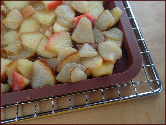 Cooked pears and apples on dehydrator tray.