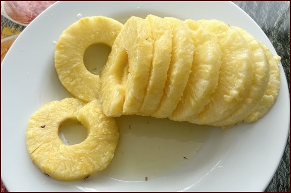 Pineapple rings removed from pineapple corer.