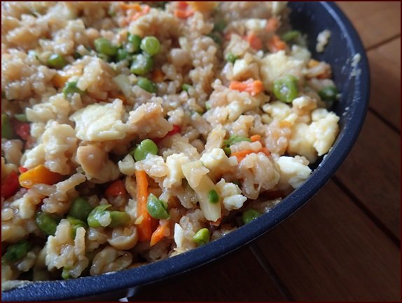 Backpacking fried rice meal in a pan.