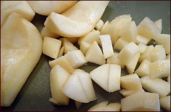 Cutting a pear before blending to make pear fruit leather.