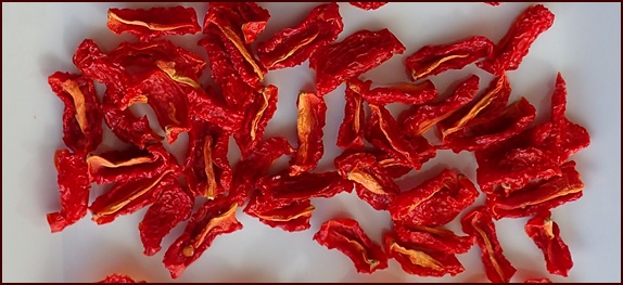 Dehydrated cherry tomato quarters.